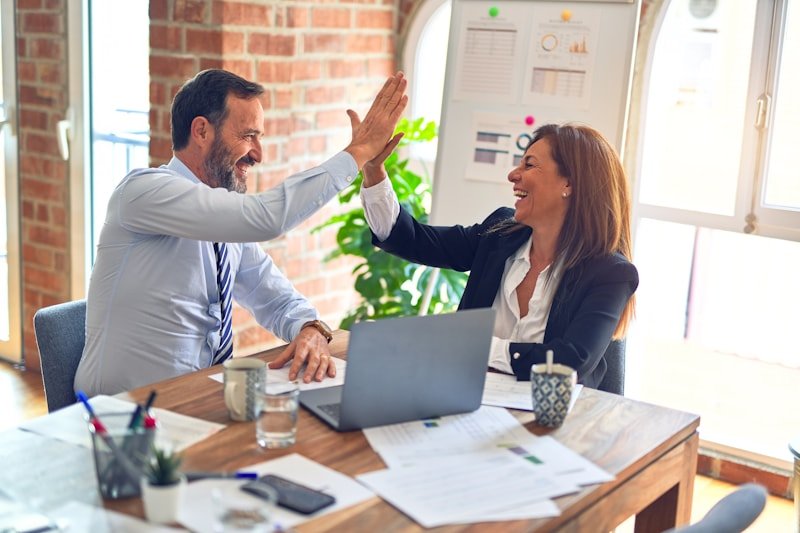 Business coaching session — two professionals in focused discussion